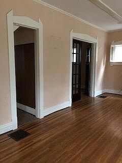 living room leading to dining room and kitchen area