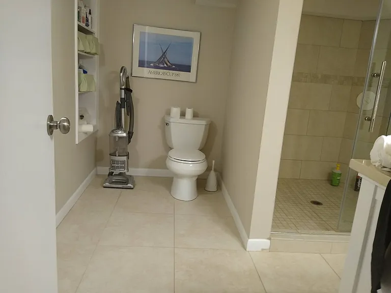 Renovated basement bathroom with Italian porcelain tile and underfloor heating.