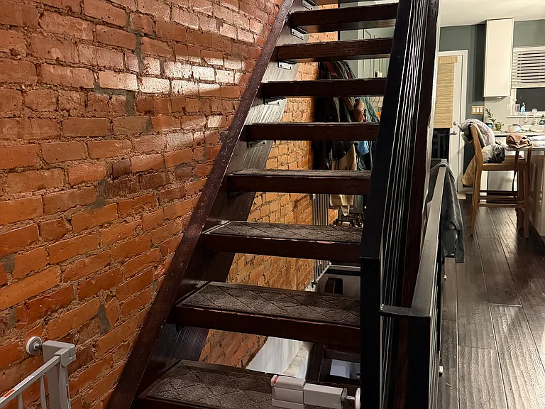 Stairwell made of thick floating steps, wrought iron; same throughout house