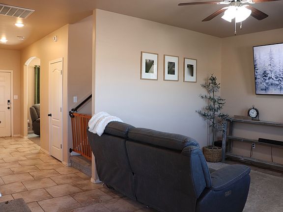 looking at front door living room and stairs to 2nd floor.