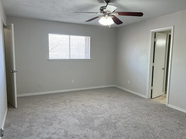 One of three bedrooms on the second level.
