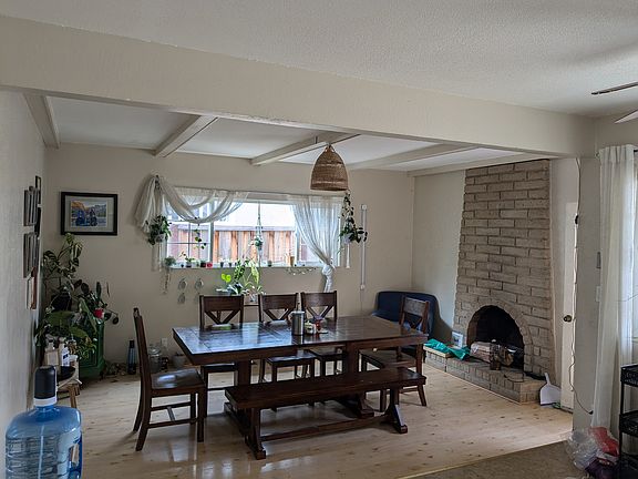 Family room with wood burning fireplace. (For illustrative purpose only)