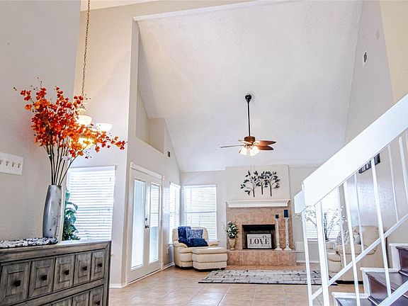 This is what you see as soon as you walk in your front door. Wow! Super high ceilings, lots of windows overlooking the huge covered patio. To the right you have the master bedroom and to the left towards the front of the house you have the kitchen.