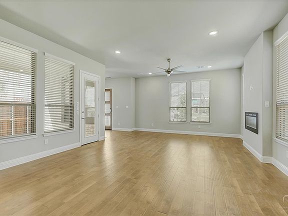 Living room in the Merlot home plan by Trophy Signature Homes - REPRESENTATIVE PHOTO