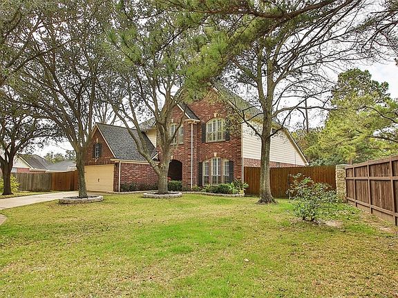 Large lot is fenced & landscaped w/lots of potential for furthering your outdoor vision.