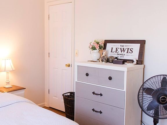 Roughly 2 or more feet between bed and dresser