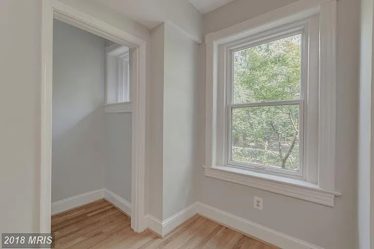 One of two front windows facing Montrose Park