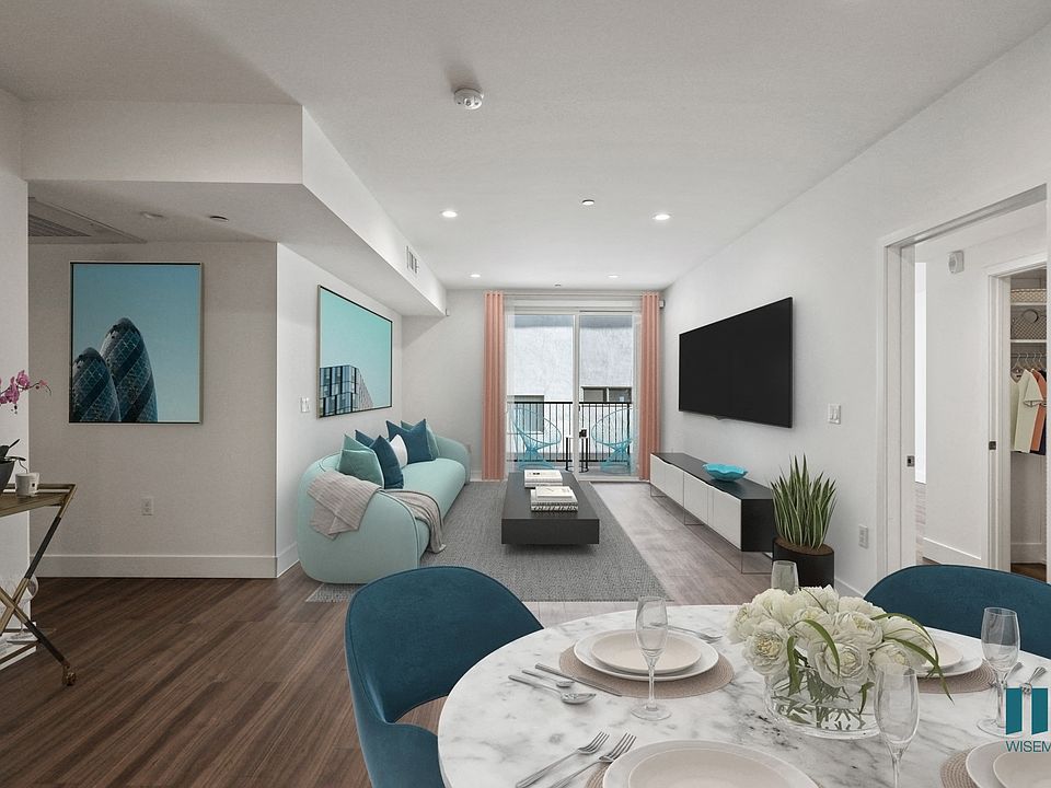 Open-Concept Dining and Living Room with Patio