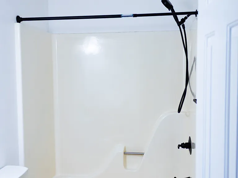 Next to the guest bedroom, the guest bathroom features a shower tub, a new toilet...
