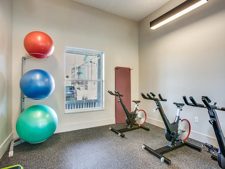 Spin room with spin bikes and ab yoga balls
