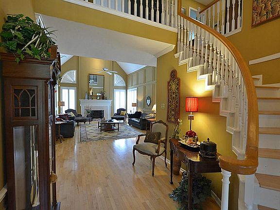 A very wide entryway to the family room. Great for displaying an art piece or additional furniture.