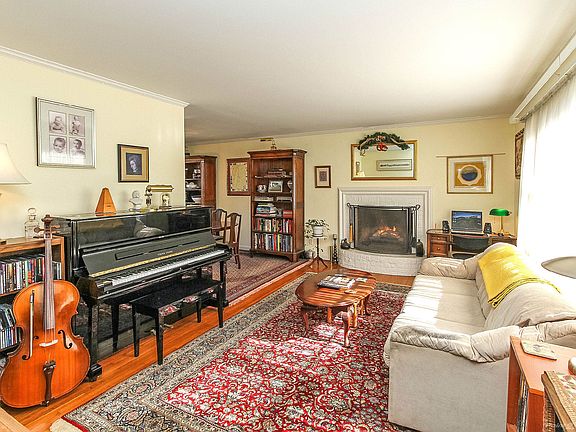 Gas log fireplace is focal point of living room