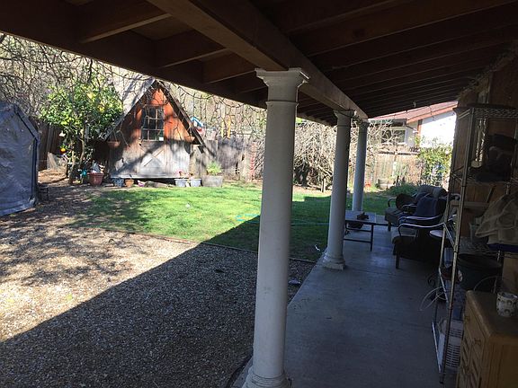 View of veranda and yard.