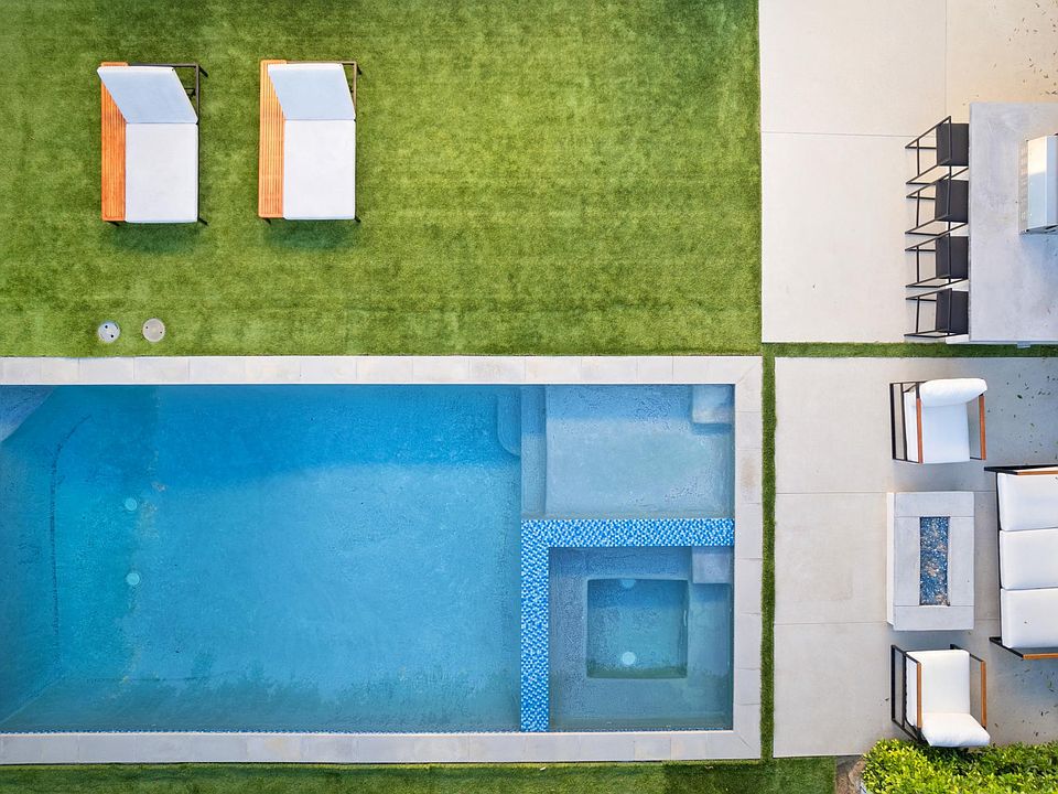 Private outdoor lounge area with pool & spa