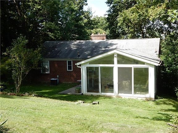 A view of the back of the home, 15X15 patio enclosure with lots of natural light