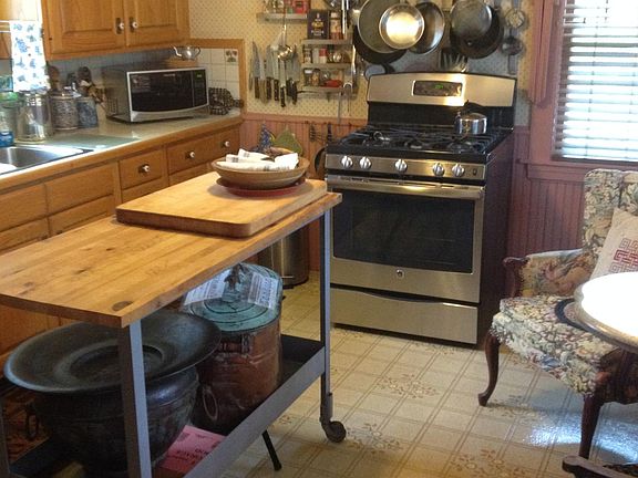Fully applianced country kitchen complete with cookware and