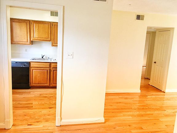 Kitchen on left with entrance to bedrooms and bathroom on right.