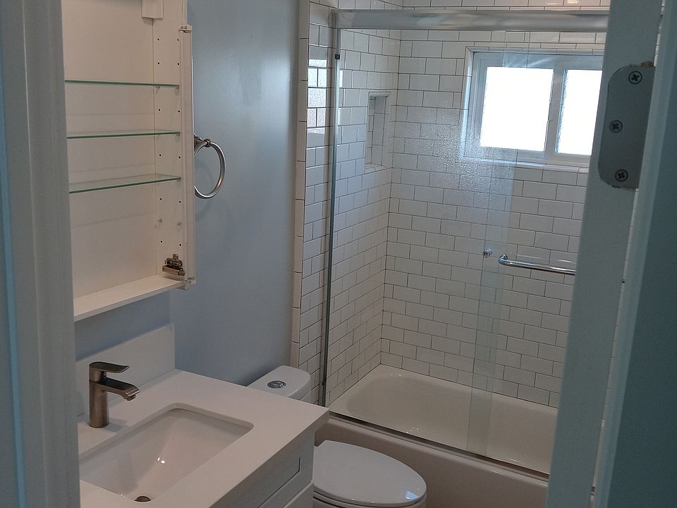 Updated and fresh full bathroom with a 1/4 bathroom downstairs