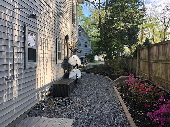 Left Side of House with Kayak/SUP Racks and Shower