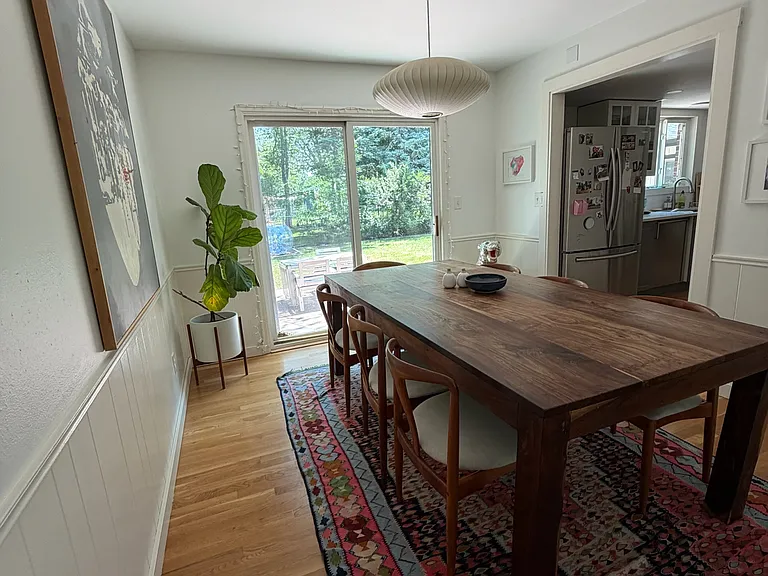 Dining room with sliding glass door to patio and backyard