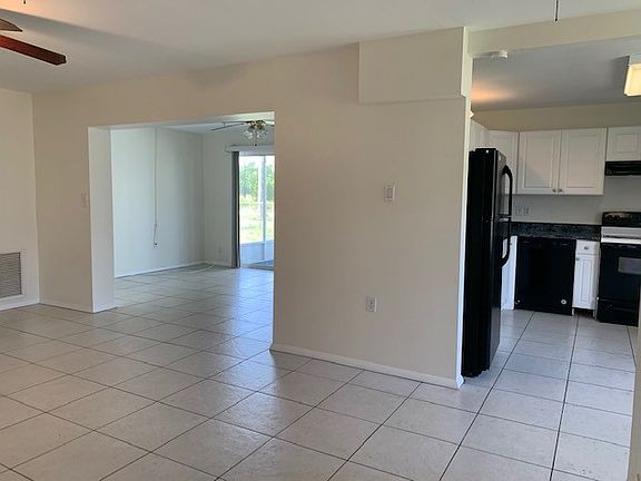 View from front door into Living room, kitchen and bonus room
