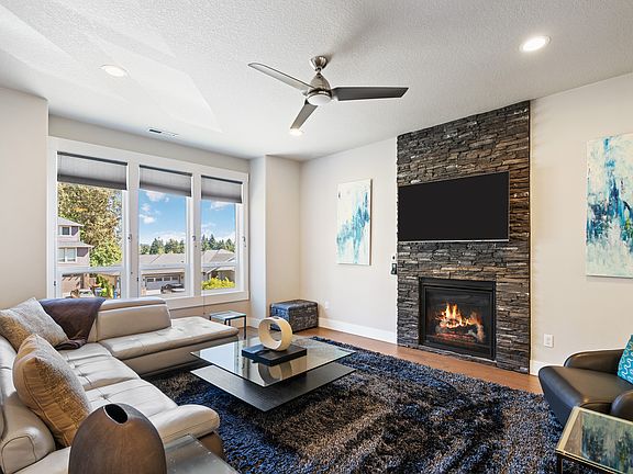 Cozy living space with gas fireplace and smart TV. Views of Mt. Hood on clear days!