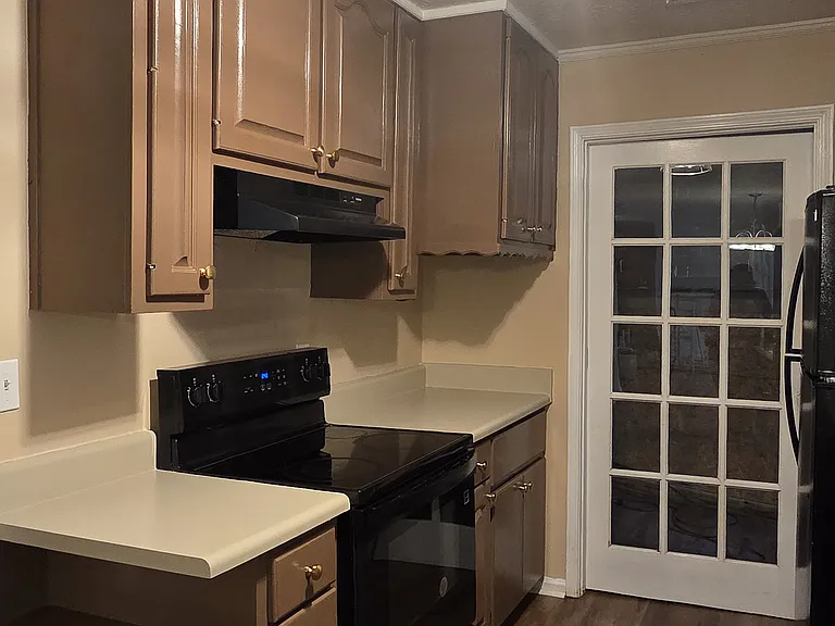 Kitchen Cooking Area with plenty of shelving