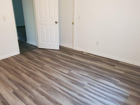 Bedroom 1 w/ access to screened patio