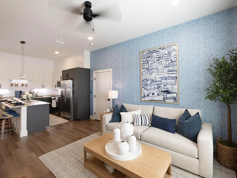 Living room with sectional couch and entertainment center