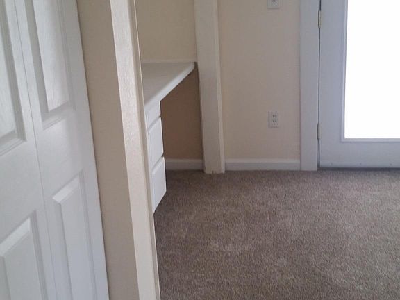 Entering Master Bedroom, vanity on left, french doors going out onto a deck