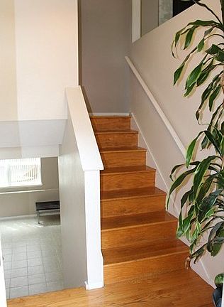 Two story entry with oak landing and stair well offer easy access to the upper floor or lower family room and 3rd bedroom.