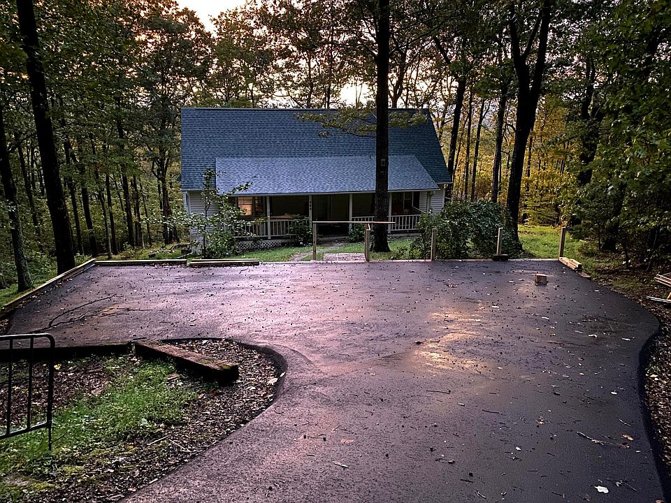 Private paved parking set off the road