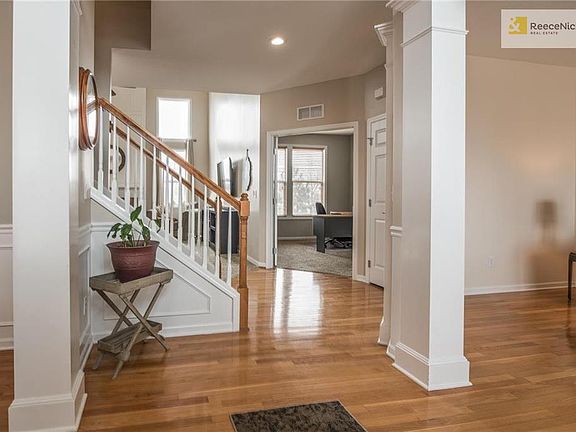 Foyer with gleaming hardwood floors