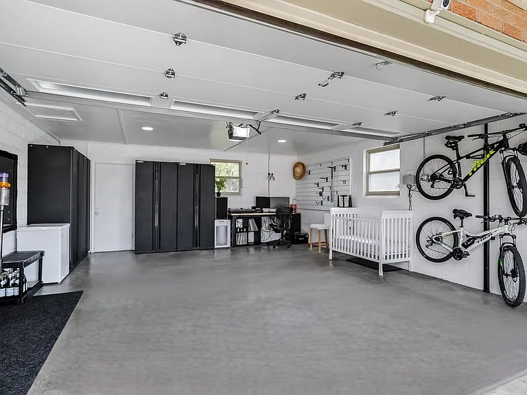 large garage with plenty of storage space and racks for your bikes