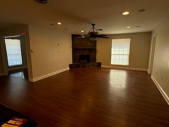 Large den with fireplace