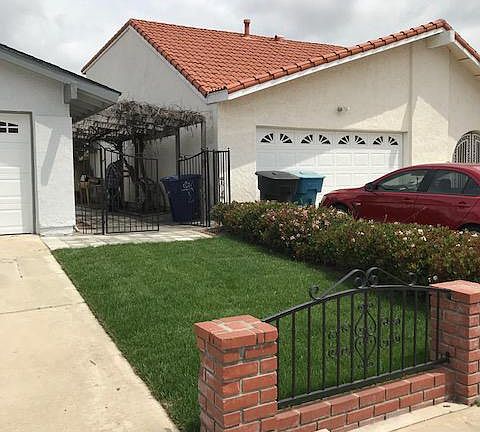 Side yard entrance with new grass