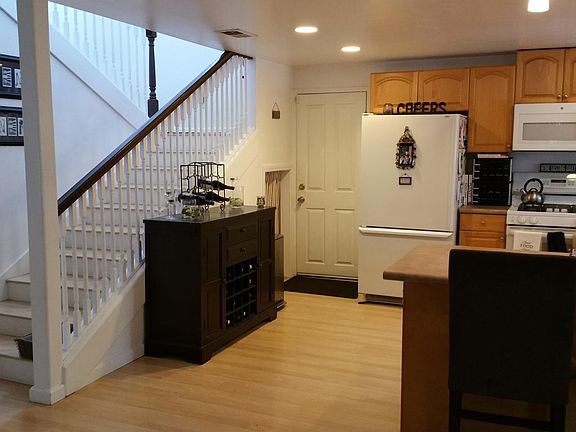 Kitchen,garage door, stairs to Primary suite