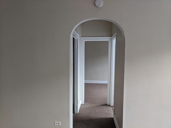 Hallway from living room - walk in closet is on the left, bathroom is on the right and bedroom is straight ahead.