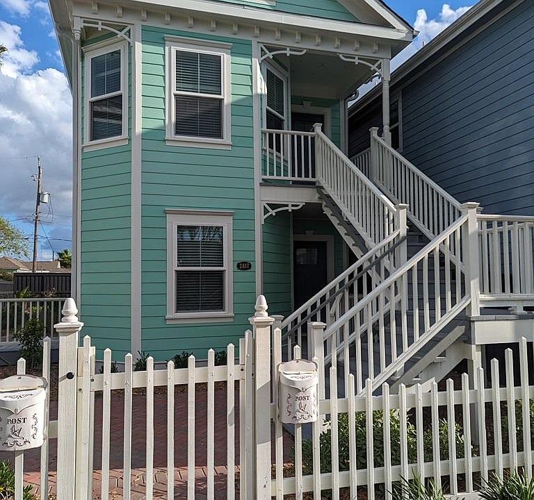 View of the duplex from the sidewalk. Note the Victorian charm and brick walkway! This building has recently been fully renovated and includes high-end appliances and features throughout!