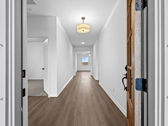 An inviting entry sets the tone, opening into a bright and spacious open-concept design.