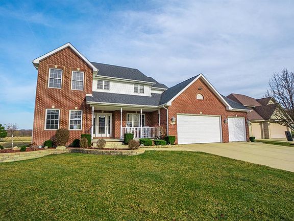 BEAUTIFULLY LANDSCAPED, FRONT COVERED PORCH W/CAN LIGHTS & UPGRADED GLASS FRONT DOOR, FULLY FINISHED EXTRA LARGE 3-CAR GARAGE W/REAR OVERHEAD GARAGE DOOR, 3-CAR WIDE CONCRETE DRIVEWAY!