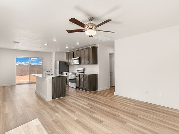 This floor plan is filled with natural light from sliding glass doors.
