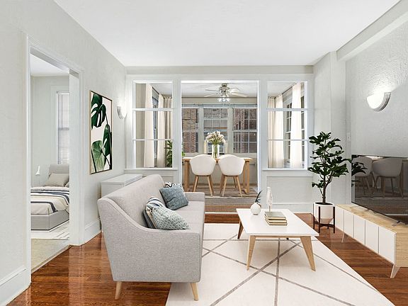 Living and sunroom (virtually staged)