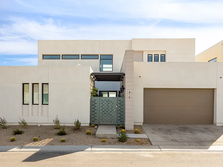 This home has a garage that can accommodate up to four vehicles. There is an electric vehicle (EV) charging station available inside the garage.