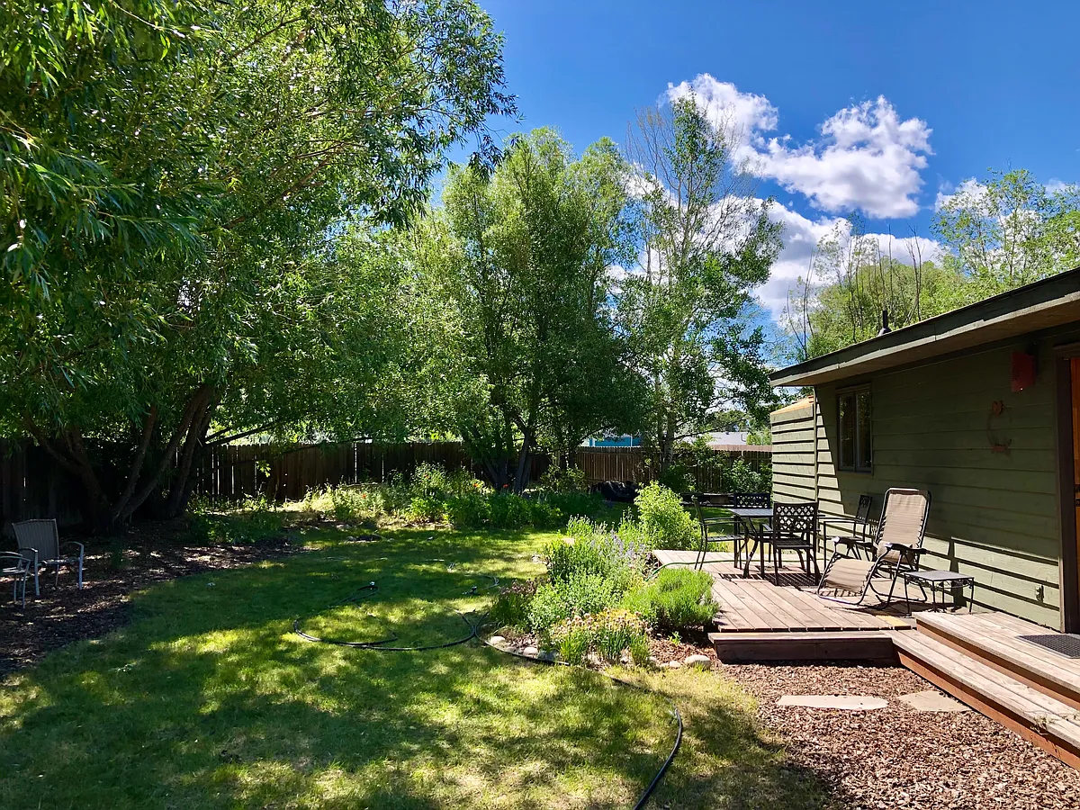 Spacious fended in back yard with gardens. - 2076 Cedar Loop