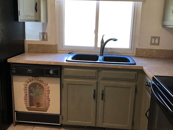 Kitchen Sink and Dishwasher. Ceramic tile Floor