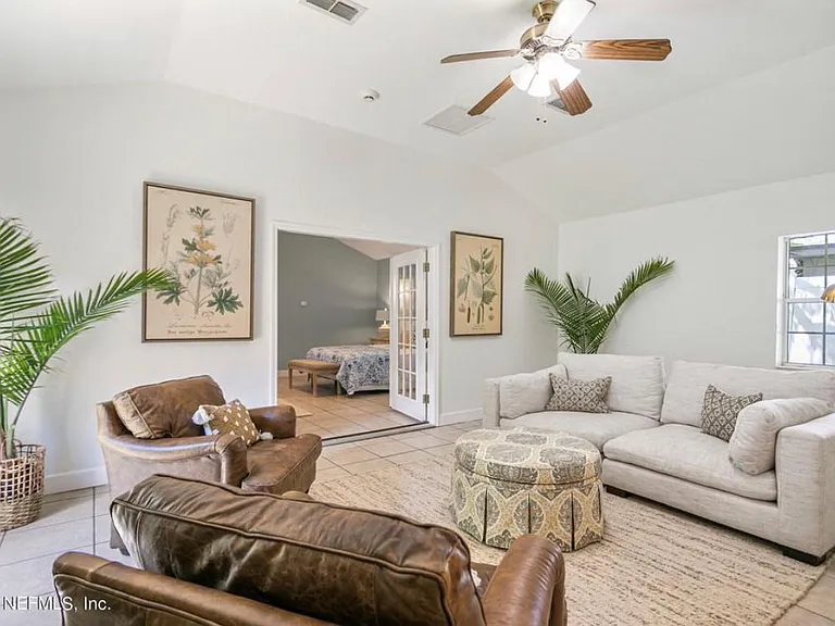 Bonus living room (back of the house). Includes exterior doors to backyard and front yard.