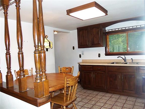 Eat-in kitchen with electric stove, refrigerator, micro-wave & ceramic floor