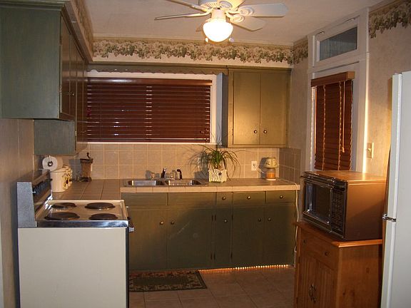 Kitchen with stove and refrigerator included