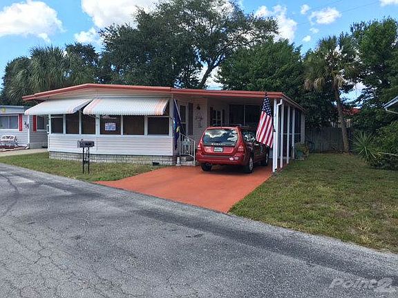 Front of home with carport